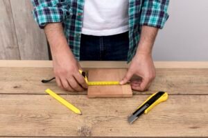 Carpenter Man Using Ruler Cutter